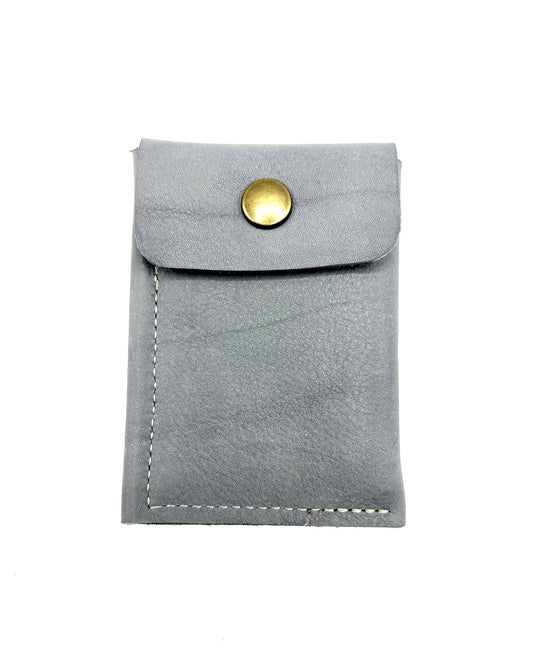 Load image into Gallery viewer, The back of the grey leather wallet showing the button closure for the coin purse.
