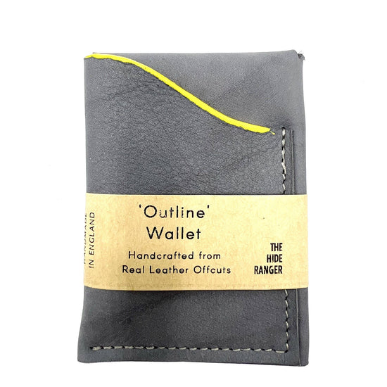 Grey leather wallet with a curved front along the card holder opening. The curve is painted bright yellow. A paper belly band is around the centre. TExt on belly band: Outline Wallet, handcrafted from real leather offcuts. The Hide Ranger.