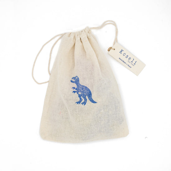Load image into Gallery viewer, Natural drawstring cotton bag with a stamped blue Tyrannosaurus on he front.
