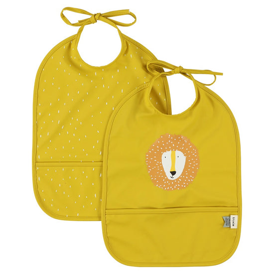 Two yellow bibs. One with an illustration of a lion and the other with white spotted pattern.