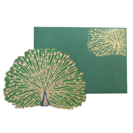 Green and gold peacock card and envelope on white background.