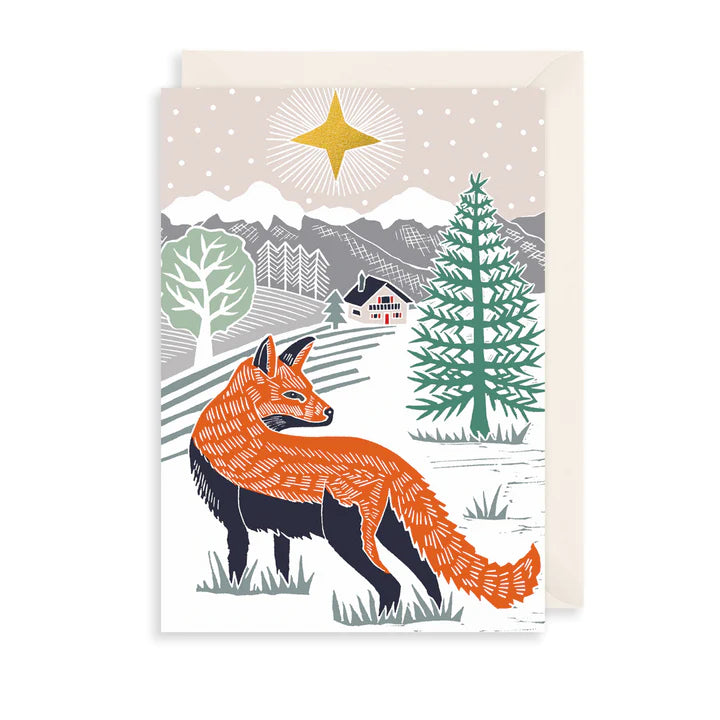 Greetings card with a beige envelope, card has an illustration of a fox in a winter scene. White background.