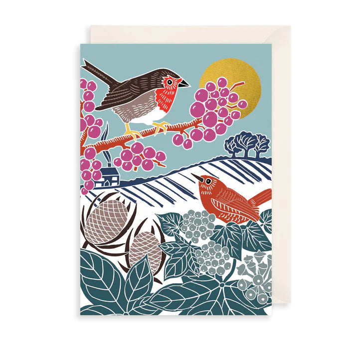 a christmas greetings card with beige envelope. Featuring an illustration of a Robin and a Wren in a wintery scene