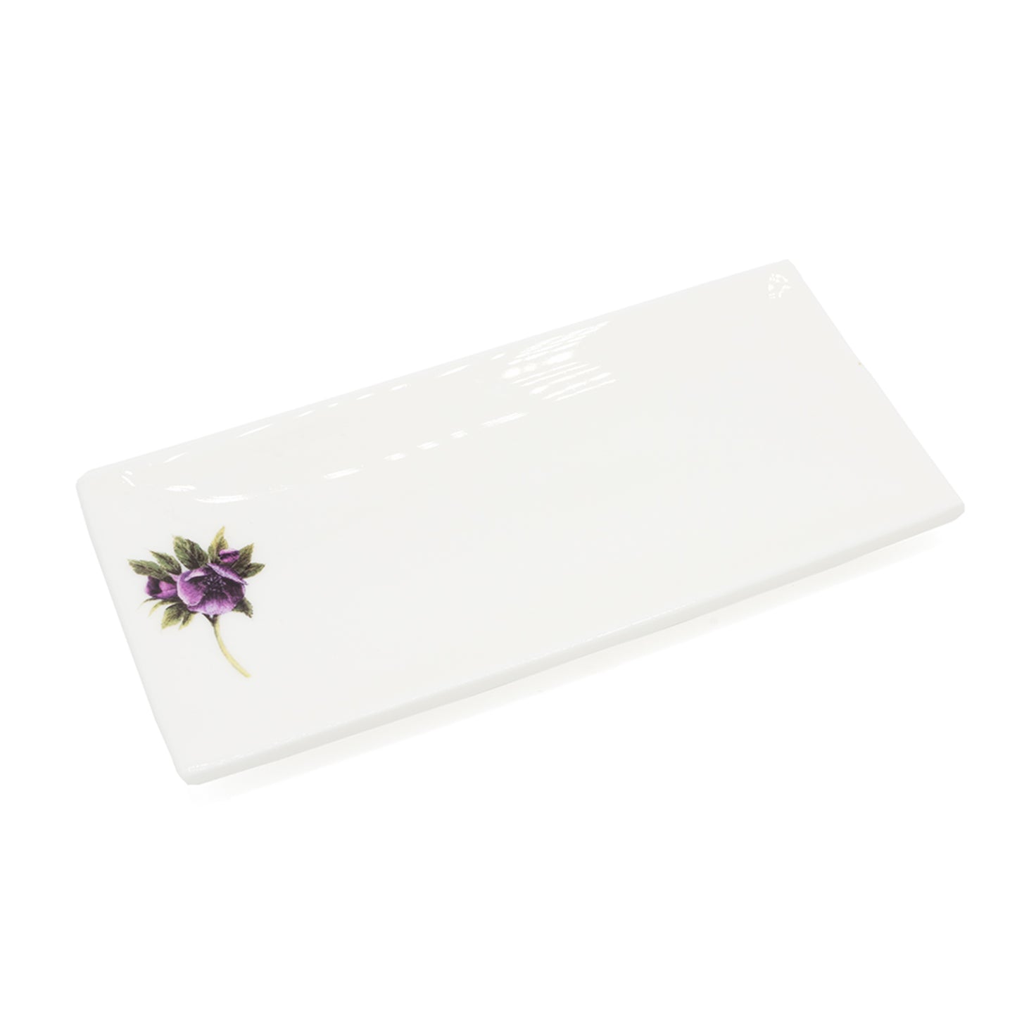 Load image into Gallery viewer, White rectangular soap dish with an illustration of a hellebore flower. Photographed against white background.
