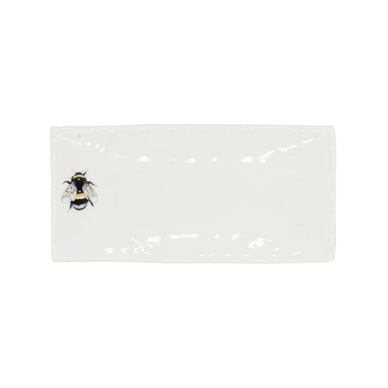 Rectangular soap dish with a picture of a bee on it. Photographed against white background.