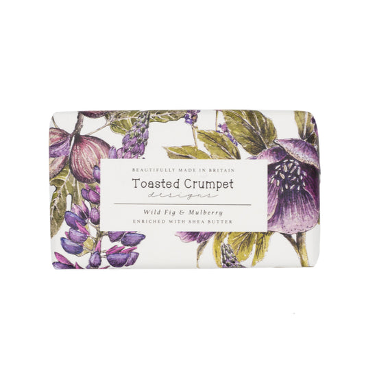 Rectangular soap in purple, white and green floral packaging with Toasted Crumpet branded label. Photographed against white background.
