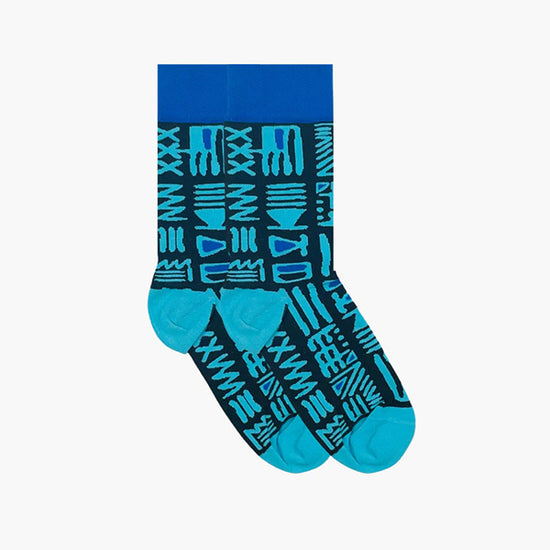Blue socks in a Bamana inrpired pattern - white background.