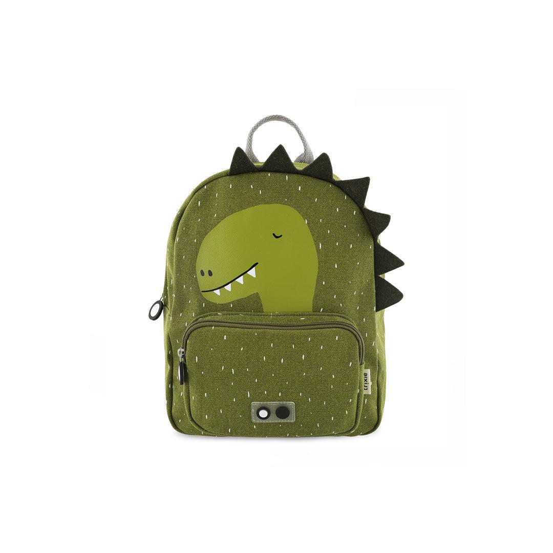 Green backpack with a dinosaur face on it and triangular fabric spikes going down along the top middle to right side.