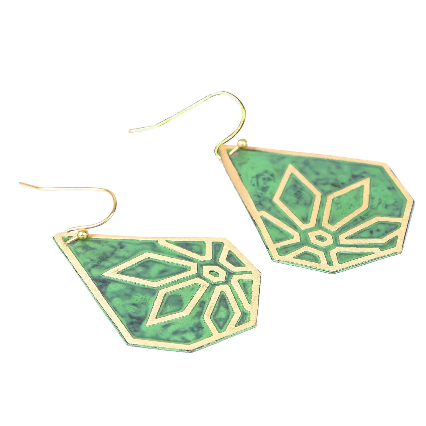 Teardrop-shaped earrings with a green enamel background and a gold-toned geometric snowflake design.