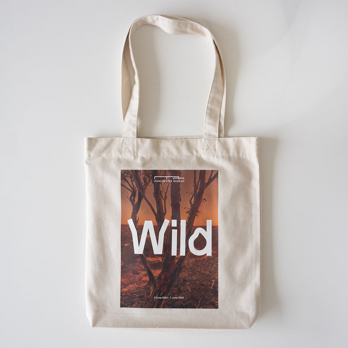 Cream tote bag with the Wild exhibition image and logo placed a the centre.