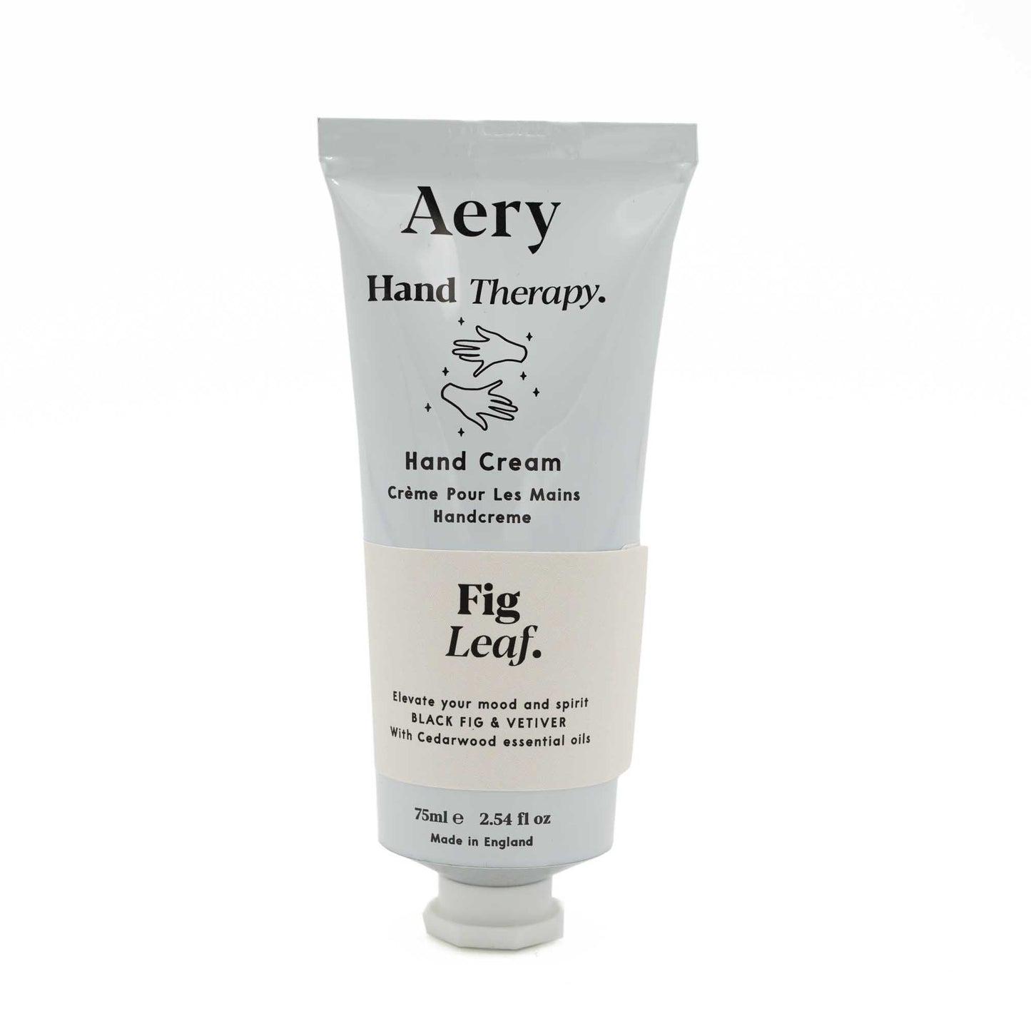 The hand cream in the pale grey tube with a cream coloured sticker. Black text from top to bottom reads, Aery, Hand therapy, hand cream, fig leaf.
