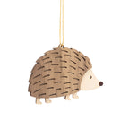 Hedgehog decoration in two tone brown and beige with a gold string attached to the back for hanging.