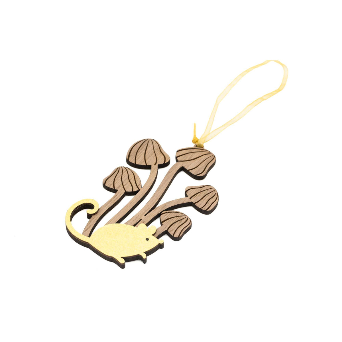 Small bronze mouse at the bottom of five brown mushrooms of varying height with the tallest in the middle from which the gold ribbon hangs. Seen at an angle.
