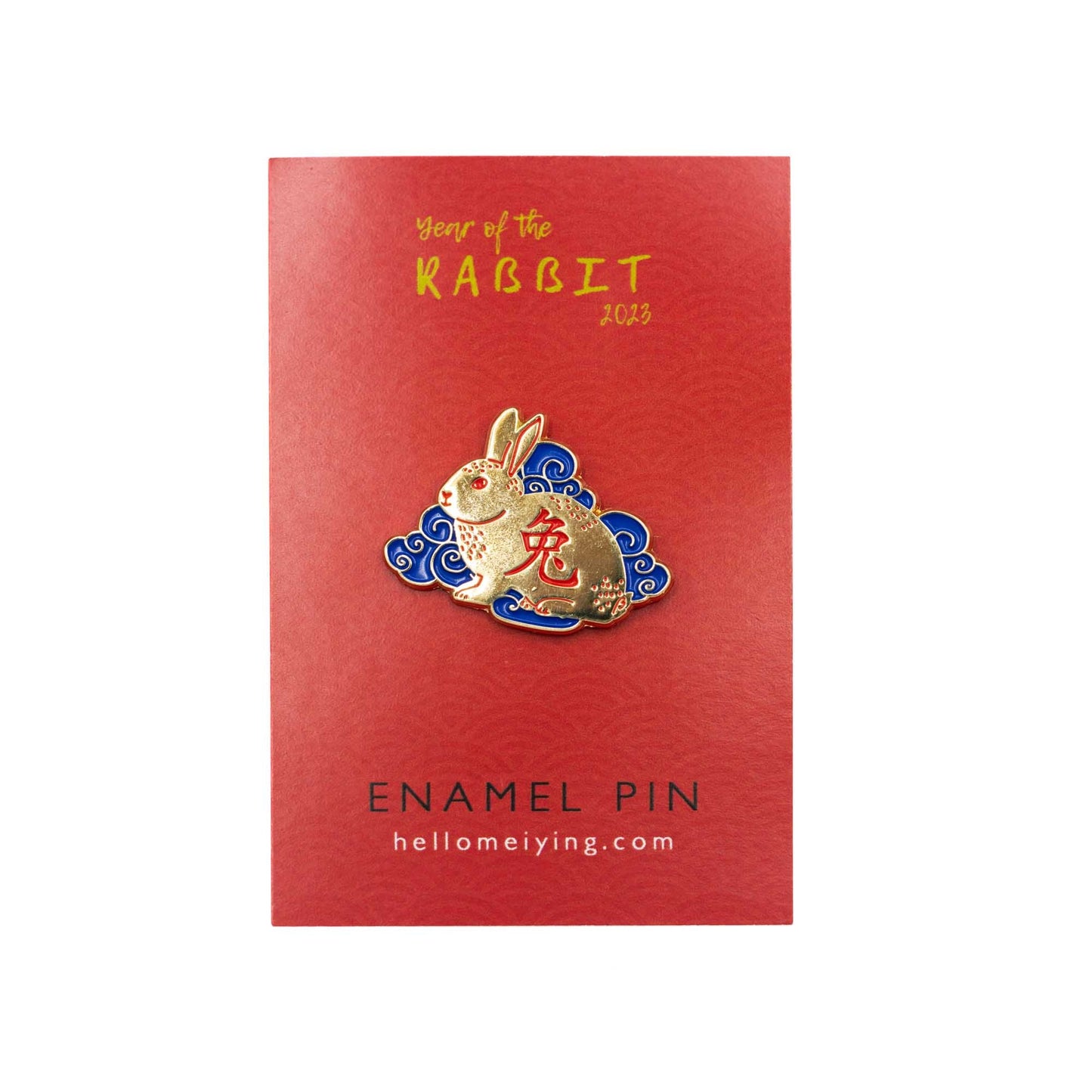 Red Card backing with the golden and blue rabbit for year of the rabbit pin. The rabbit itself is golden with red chinese character in the body, it's sitting amongst blue clouds.