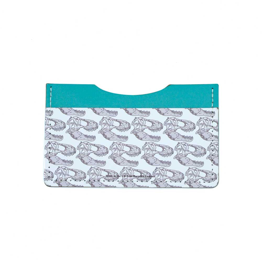 Load image into Gallery viewer, The turquoise and white recycled leather card wallet seen straight on from the back. The t-rex skull illustration is only present on the white leather along the bottom.
