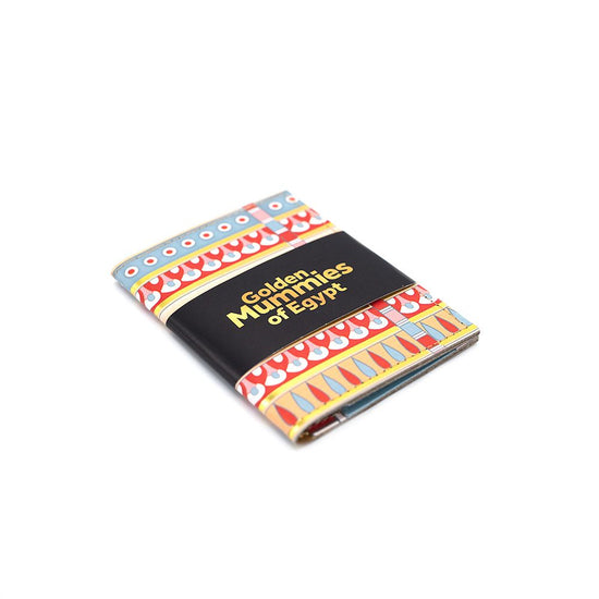 Folding card holder with black belly band with gold text saying, Golden Mummies of Egypt.