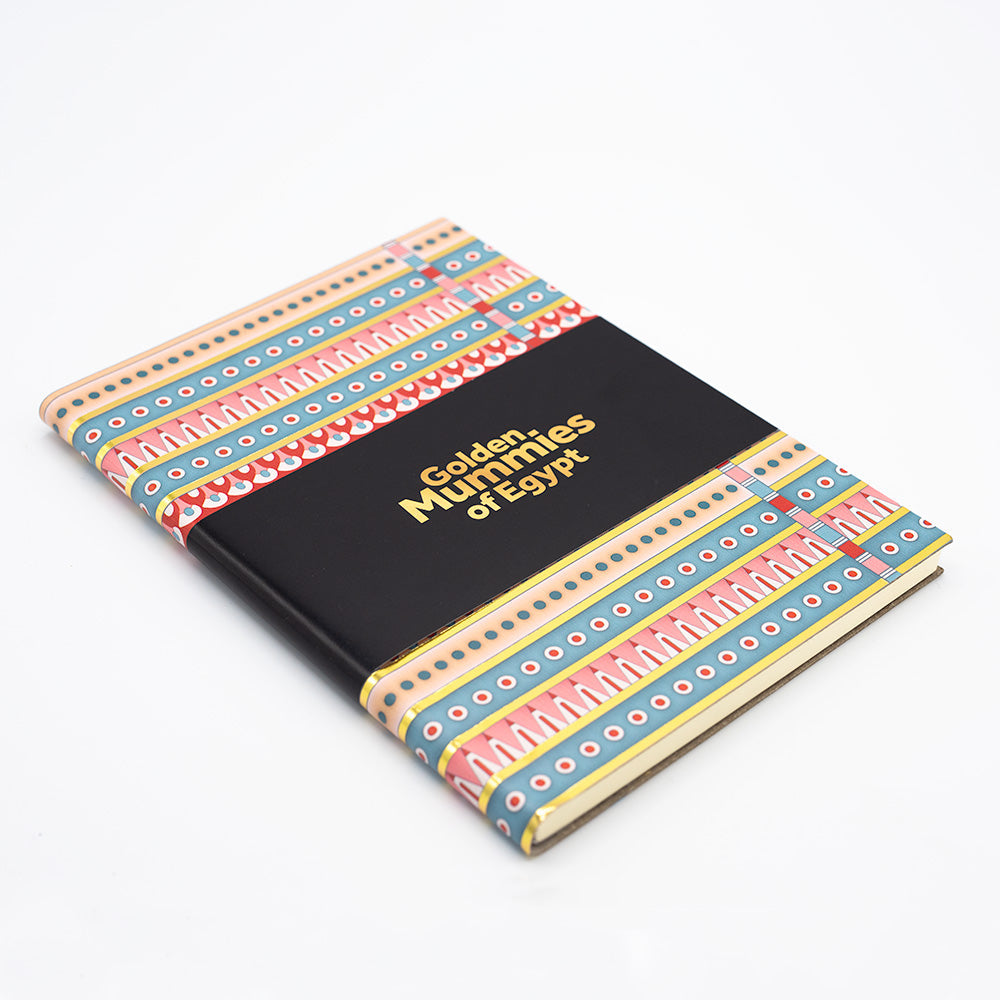 Side angled view of the patterned notebook with the black belly band.