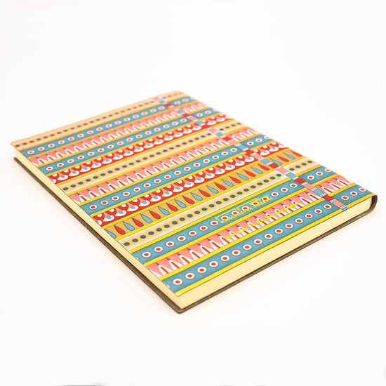 Side angled view of the patterned notebook  without the belly band.