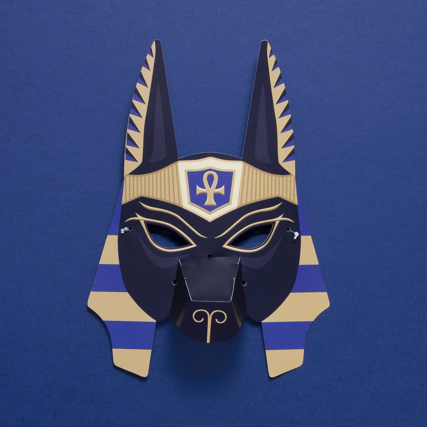 Load image into Gallery viewer, Anubis jackal mask with long pointy ears and seen against a blue background.
