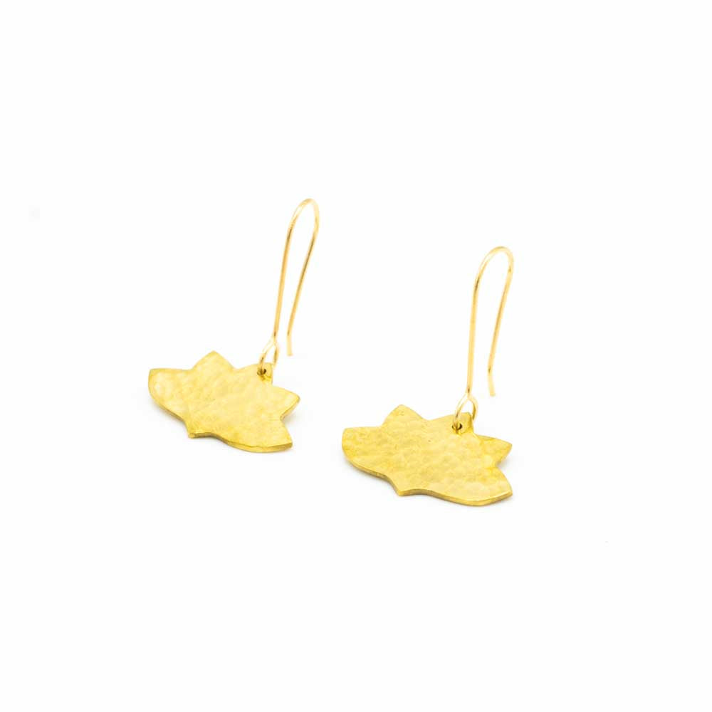 Brass lotus shaped earrings against a white background.