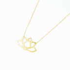Brass Lotus statement necklace with the chain vanishing off on the right.