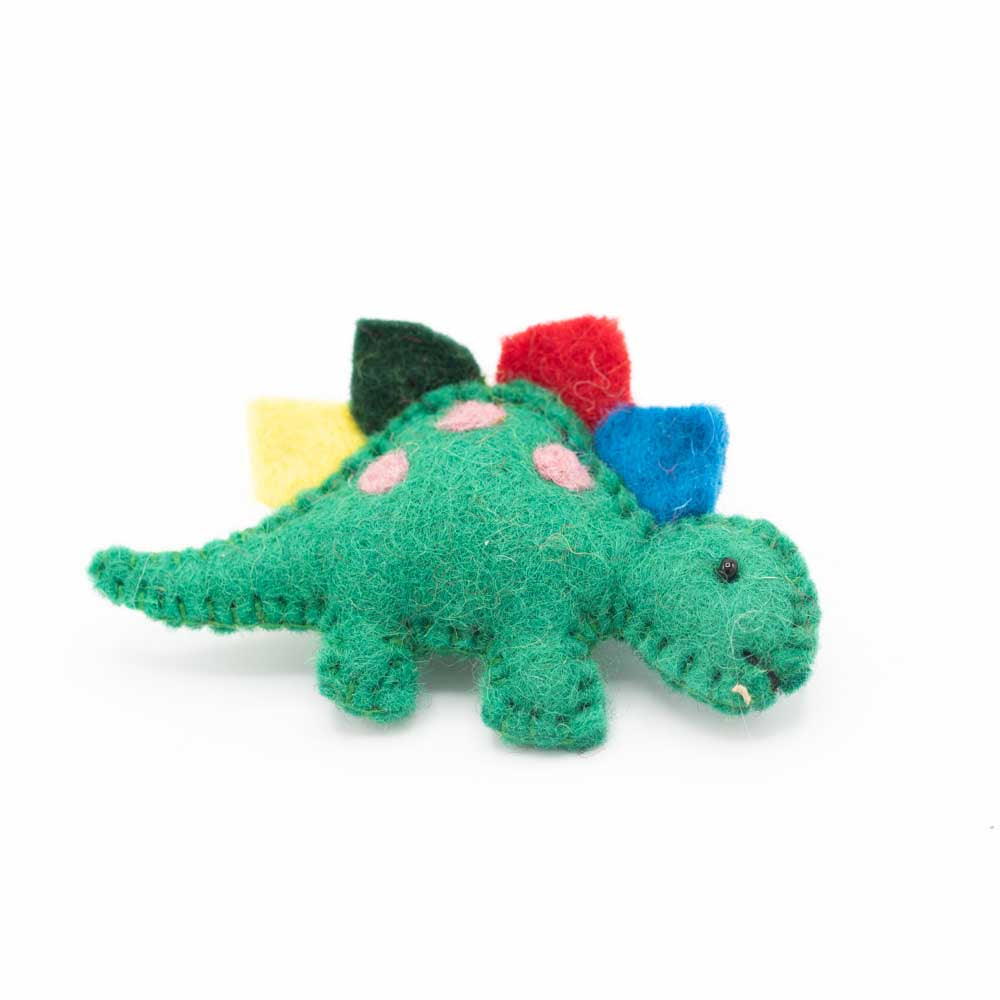 Dark green felted stegosaurus brooch against a white background.