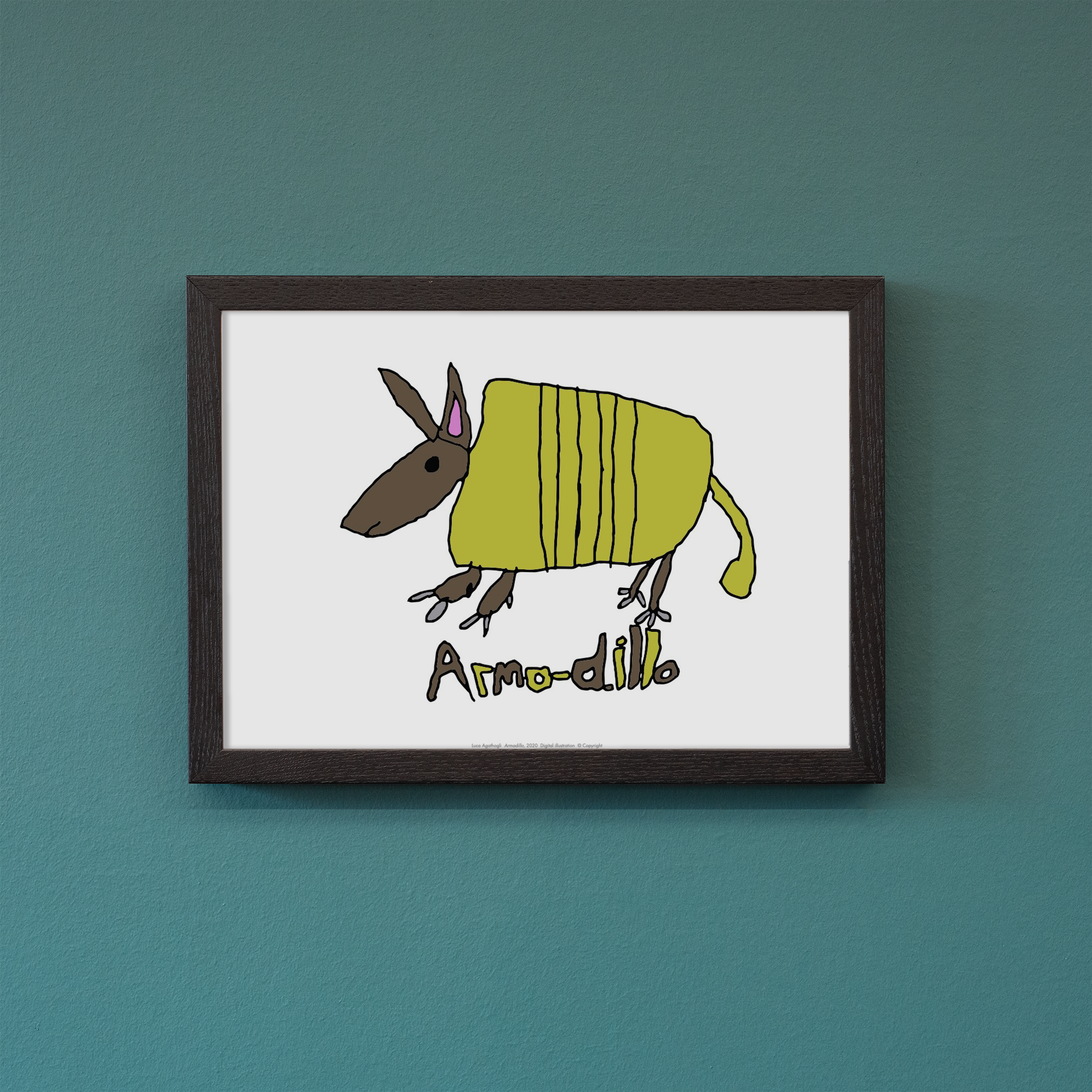 Framed reproduction of an Armadillo artwork photographed against a blue wall