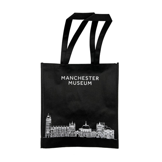 Black museum branded tote with white text: manchester Museum. Across the bottom is a white illustration of the museum building.