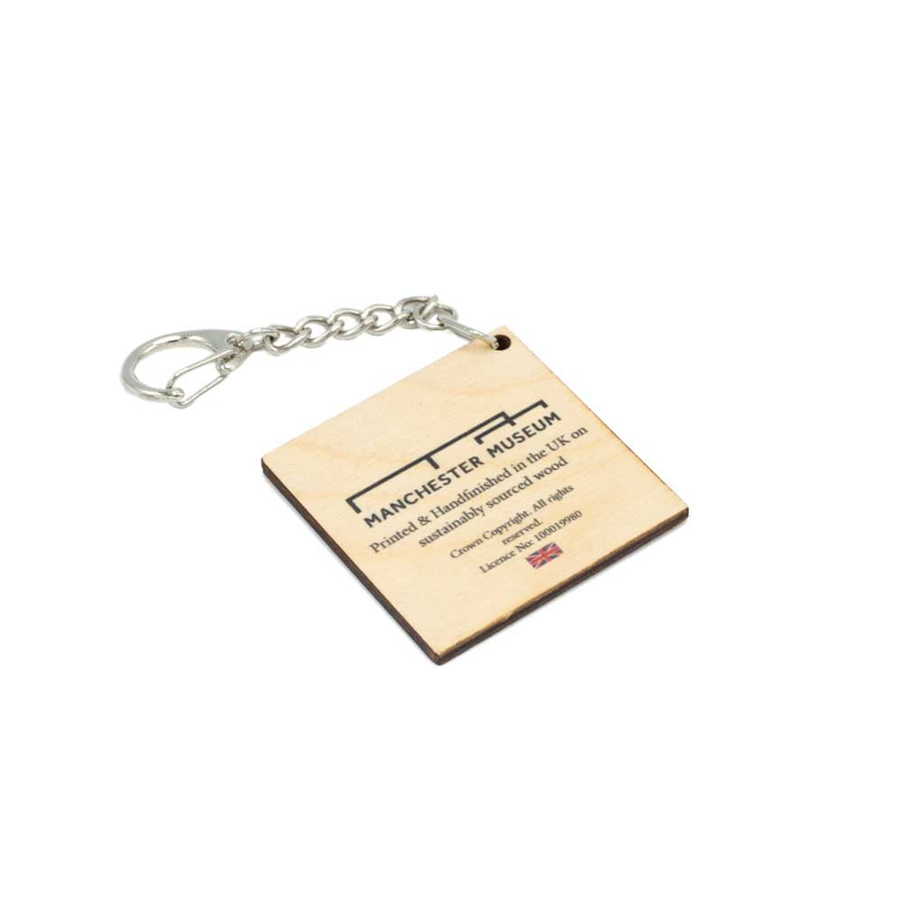 Reverse of square wooden keyring with Manchester Museum branding