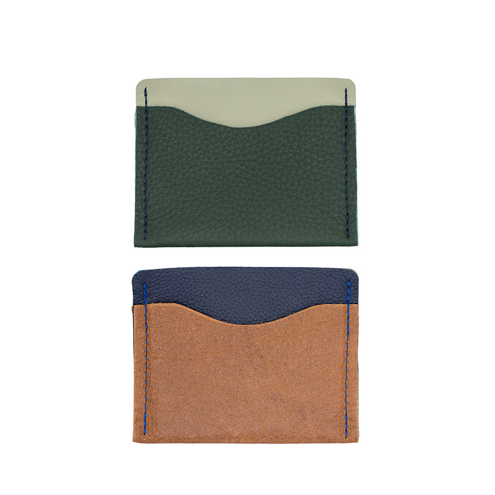 Both the dual leather purses with the green and pistacchio on top and the navy and tan below. 