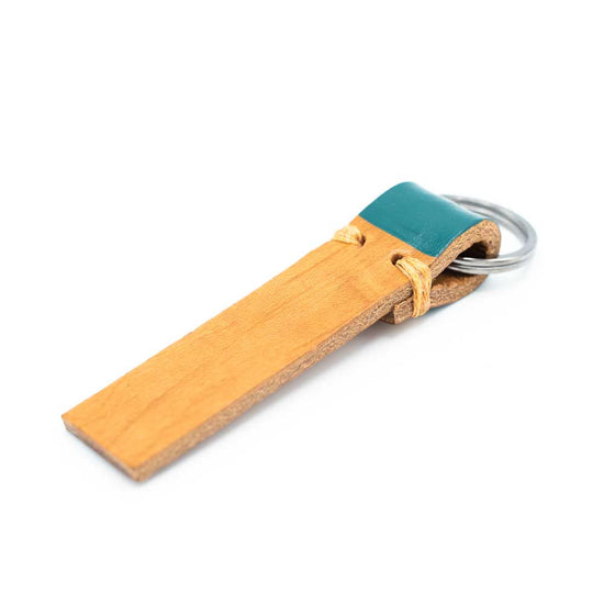 Tan leather strip keyring with goblin colour on the part that is folded around the ring.