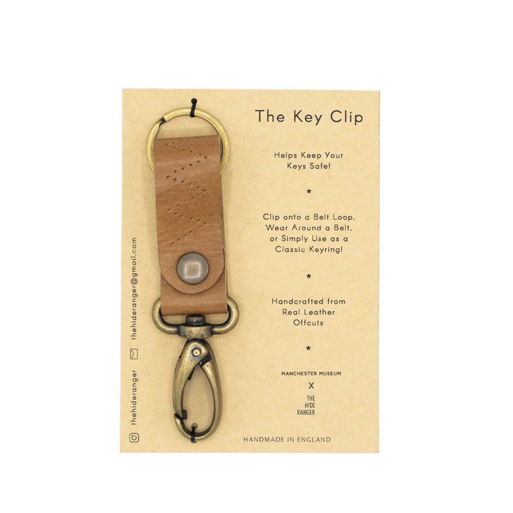 Load image into Gallery viewer, Photograph of a brown key clip against a brown card backing. Shot against a white background
