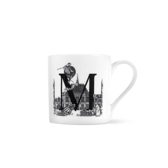 Letter M mug with simplified museum front illustration with a frog at the base of the M and a sparrow flying above.