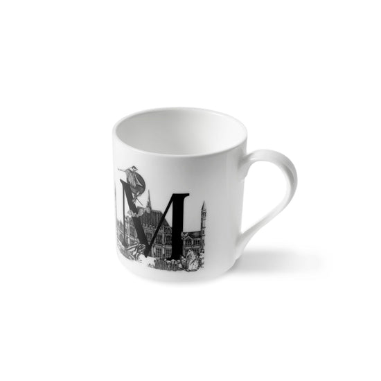 Load image into Gallery viewer, Letter M mug seen slightly from below.
