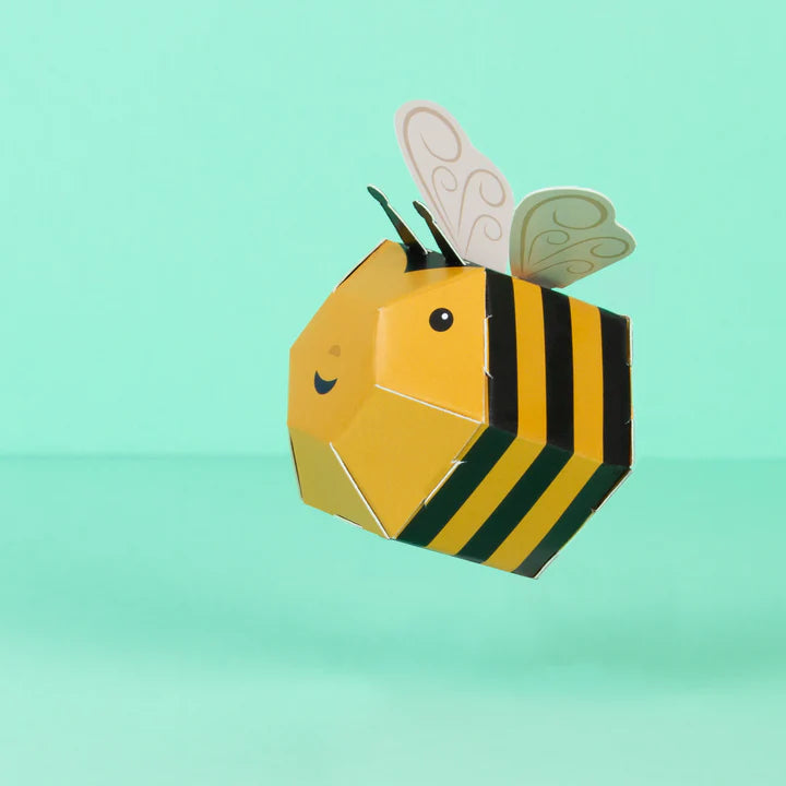 Load image into Gallery viewer, Lifestyle shot of the bee against a turquoise background.
