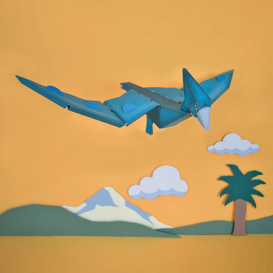 Load image into Gallery viewer, Lifestyle shot of the assembled pterosaur against an orange background.
