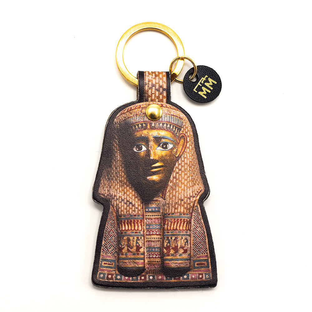 Front view of burial mask photograph keyring. The ring is golden.
