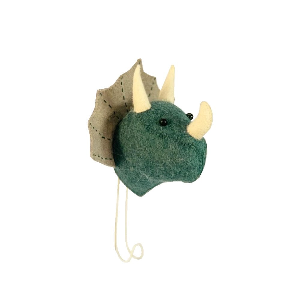 Side view of the felted triceratops head with the white hook protruding from underneath.