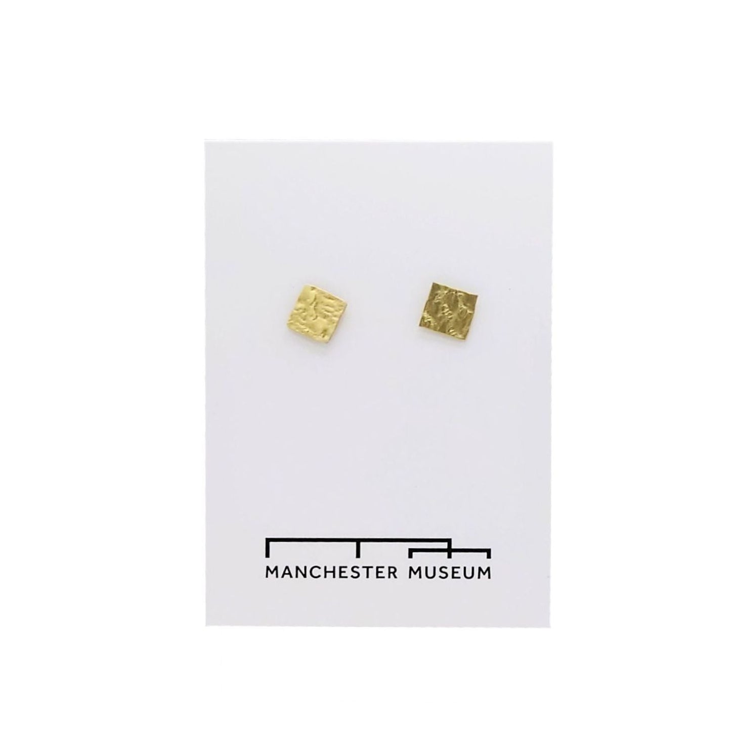Square hammered brass stud earrings on white, museum branded backing card.