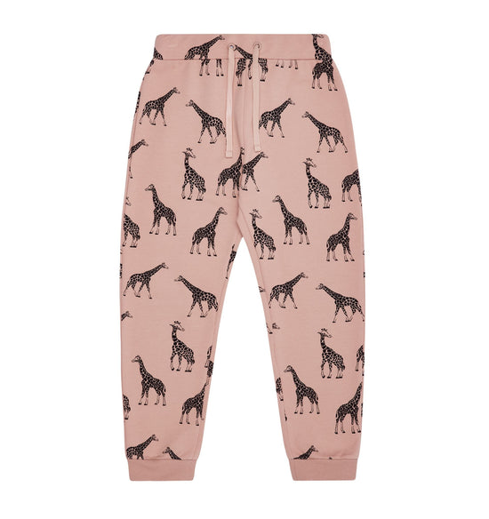 Joggers in dusky pink with giraffe outline print against a white background.