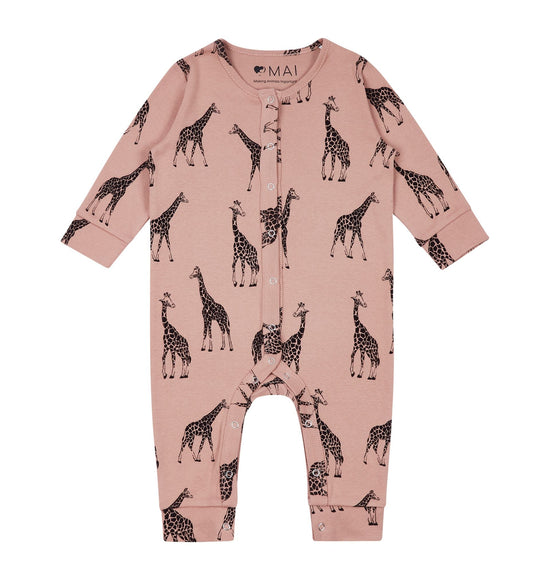 The dusky pink baby romper with long sleeves and giraffe outline print against a white background.