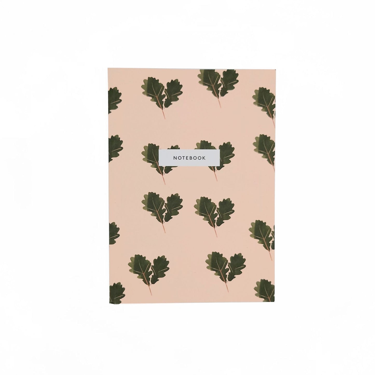Front view of dusky pink notebook with pairs of illustrated acorn leaves. In a white box one thrid from the top the black text reads, notebook.
